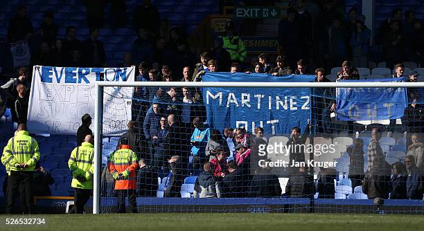 Everton supporters hold banners 'Martinez Out'' after the Barclays Premier League match between Everton and A.F.C. Bournemouth at Goodison Park on...