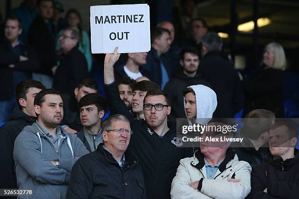 Everton supporters hold banner 'Martinez Out'' after the Barclays Premier League match between Everton and A.F.C. Bournemouth at Goodison Park on...