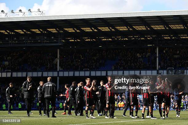 Bournemouth players and staffs applauds the away supporters after the Barclays Premier League match between Everton and A.F.C. Bournemouth at...