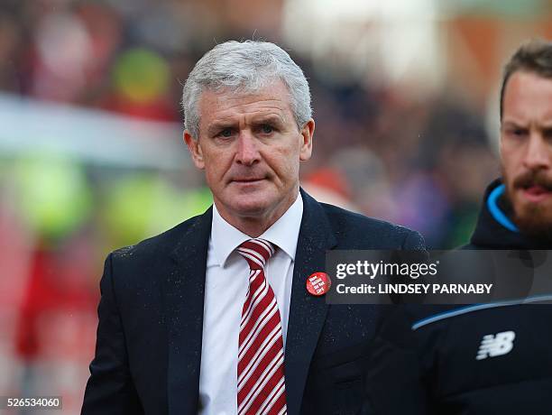 Stoke City's Welsh manager Mark Hughes leaves after the final whistle in the English Premier League football match between Stoke City and Sunderland...