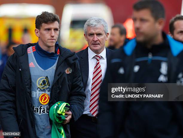 Stoke City's Welsh manager Mark Hughes leaves after the final whistle in the English Premier League football match between Stoke City and Sunderland...