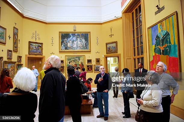 Visitors tour the Barnes Foundation in Philadelphia, PA on December 26, 2012. The collection of more than 2,500 objects, including 800 paintings,...