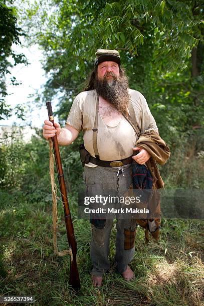 Scott Bumgarner from North Carolina, a 'hardcore' reenactor since 1988 with the 28th North Carolina Infantry, who participates barefoot, and had...