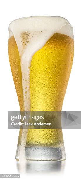 glass of beer - overflowing beer stock pictures, royalty-free photos & images