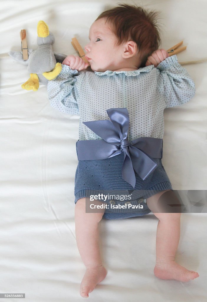 Newborn hanging on the rope