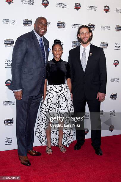 Earvin 'Magic' Johnson, Mo'Ne Davis and Madison Bumgarner attend the "2014 Sports Illustrated Sportsman Of The Year Award Presentation" at Pier 60 in...