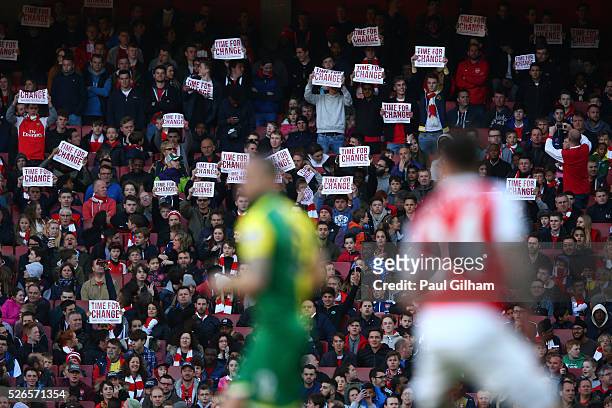 Arsenal supportes hold banners 'Time For Change' during the Barclays Premier League match between Arsenal and Norwich City at The Emirates Stadium on...
