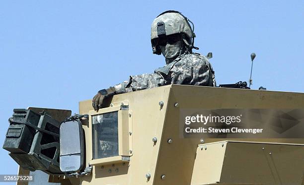 Turrent gunner standing in a MRAP watches out for the safety of his fellow soldiers in the eastern Afghan village of Serobl. He is a member of the...