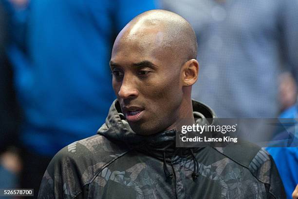 Kobe Bryant of the Los Angeles Lakers attends the game between the Duke Blue Devils and the Oregon Ducks during the West Regional Semifinal of the...