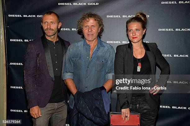 Stefano Rosso, Renzo Rosso and Alessia Rosso pose backstage at the Diesel Black Gold fashion show during Mercedes-Benz Fashion Week Spring 2014 at...