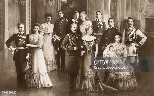 Wilhelm II, German Emperor and his spouse Augusta Victoria of Schleswig-Holstein, German Empress, with their children escorted by their spouses . Ca....