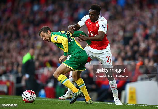 Danny Welbeck of Arsenal challenges Gary O'Neil of Norwich City during the Barclays Premier League match between Arsenal and Norwich City at The...