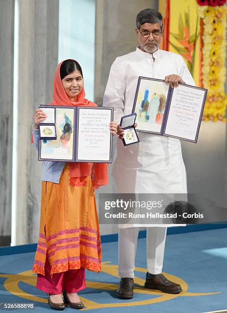 Malala Yousafzai and Kailash Satyarthi attend the Nobel Peace Prize ceremony at the City Hall in Oslo.