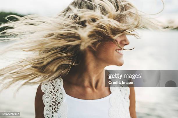 adorable girl swinging her face - tousled hair stock pictures, royalty-free photos & images