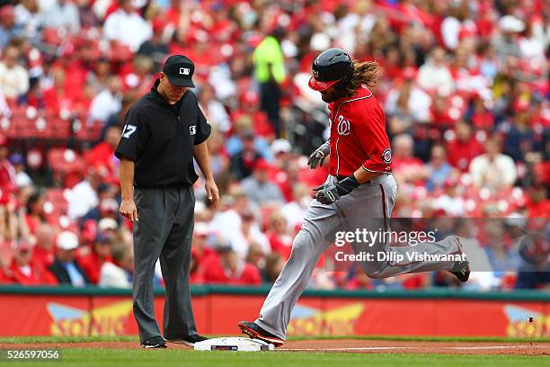 Jayson Werth of the Washington Nationals rounds third base after hitting a three-run home run against the St. Louis Cardinals in the first inning at...