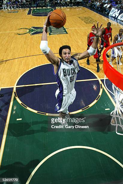 Dan Gadzuric of the Milwaukee Bucks dunks against the Toronto Raptors on April 19, 2005 at the Bradley Center in Milwaukee, Wisconsin. NOTE TO USER:...