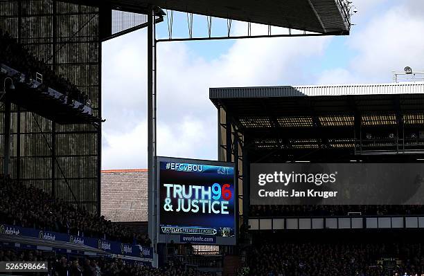 Display is seen on the big screen as family members of the victims of the Hillborough disaster join both teams on the pitch before the Barclays...