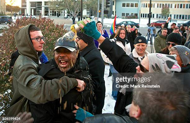 Wichita, Kansas 11-17--2014 Man in black hat is assaulted by crowd after he starts yelling that "God said no" to same-sex marriages. This occured as...