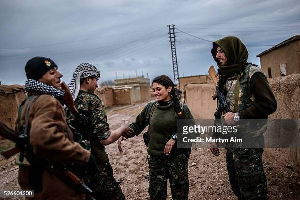 Saryazilan is 18 years old and is a Kurdish YPJ trainee who is learning to fight but has not yet been in battle. She talks with a YPG unit who are on...