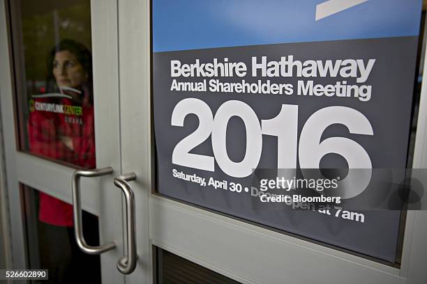 An attendee stands inside an entrance door to the Berkshire Hathaway Inc. Annual shareholders meeting in Omaha, Nebraska, U.S., on Saturday, April...