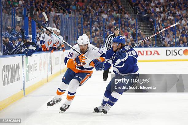 Steve Bernier of the New York Islanders battles for the puck against Matt Taormina of the Tampa Bay Lightning during the first period in Game Two of...