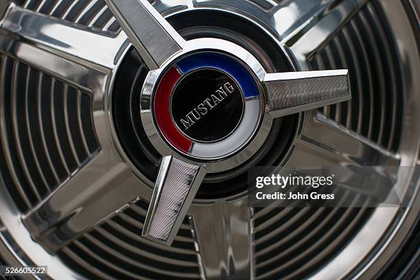 Hubcap is seen on the passenger side of Gail Wise's Skylight Blue 1964 1/2 Ford Mustang convertible in Park Ridge, Illinois November 26th, 2013. Gail...