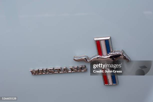 Mustang badge is seen on the passenger side of Gail Wise's Skylight Blue 1964 1/2 Ford Mustang convertible in Park Ridge, Illinois November 26th,...