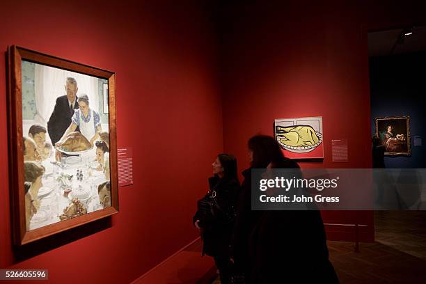 Tourists review Norman Rockwell's Freedom from Want which is part of the "Art and Appetite exhibition at the Art Institute of Chicago on December 19,...