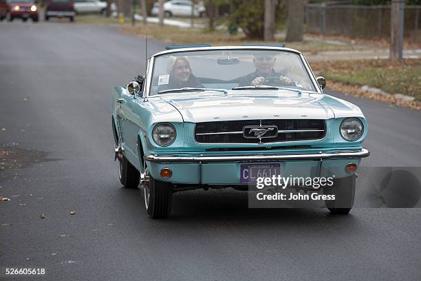 Tom and Gail Wise ride in her Skylight Blue 1964 1/2 Ford Mustang convertible in Park Ridge, Illinois November 26th, 2013. Gail Wise, then using her...