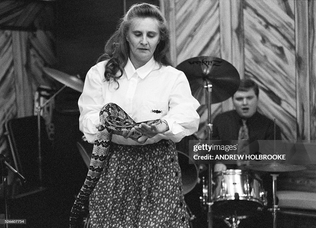 Female Snake Handler Woman handling rattlesnakes during a church service. Snake handlers ...