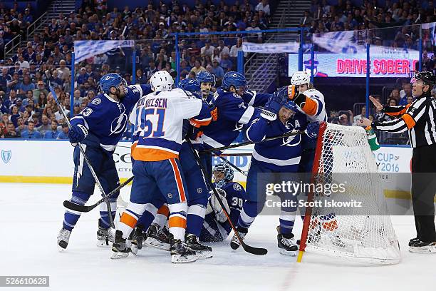 Fight breaks out a top of Ben Bishop of the Tampa Bay Lightning during the first period in Game Two of the Eastern Conference Second Round during the...