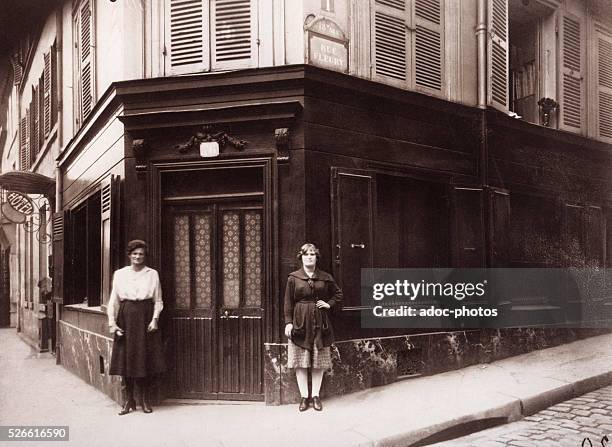 Prostitutes at the corner of the boulevard de la Chapelle and the rue Fleury in Paris . In June 1921. Photograph by Eugene Atget.