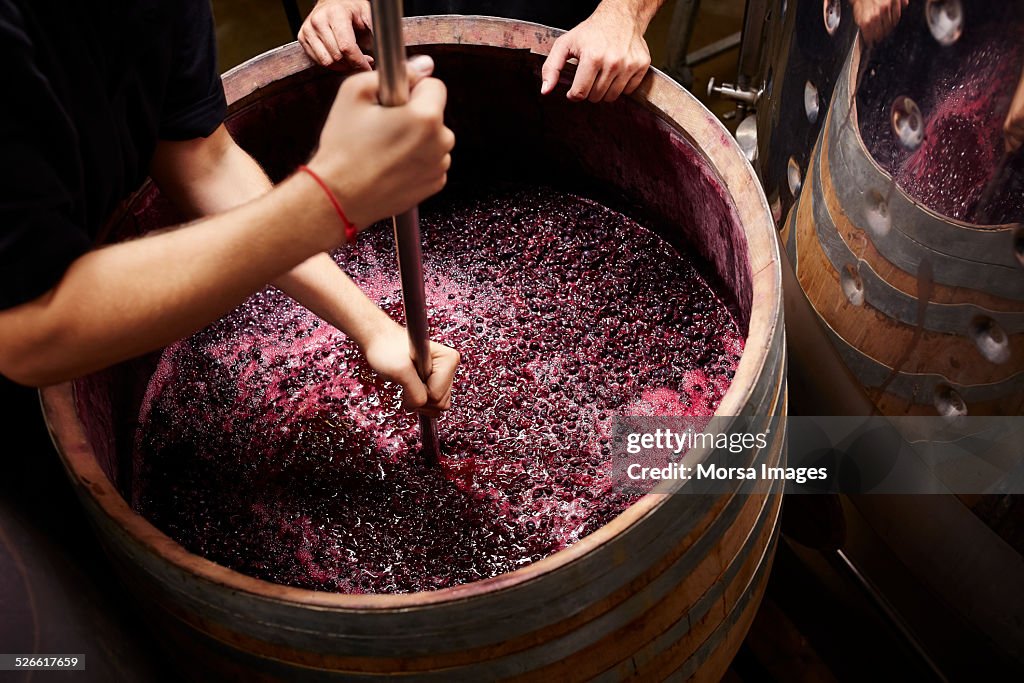 Plunging the grapes cap to extract color