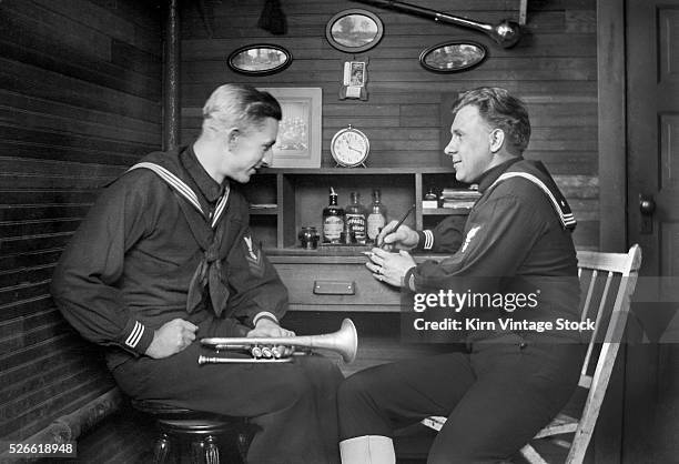 Two naval band members in their barracks.