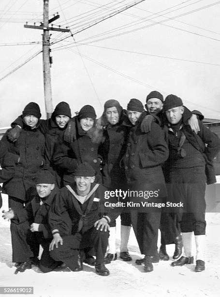 Informal portrait of navy recruits on the snowy grounds of Great Lakes Naval Training Station in North Chicago, Illinois.