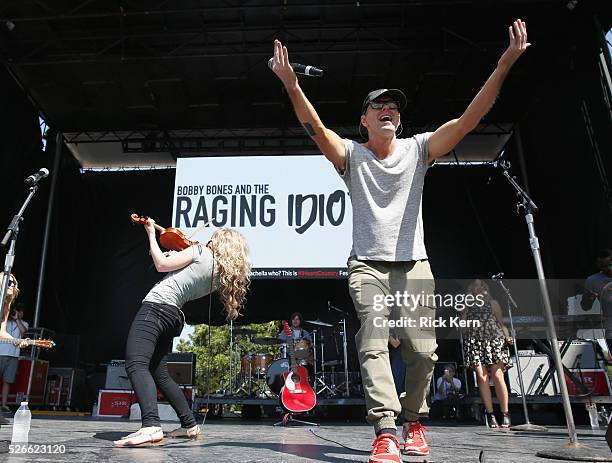 Singer Natalie Stovall and radio personality Bobby Bones of Bobby Bones and The Raging Idiots perform live during the 2016 Daytime Village at the...