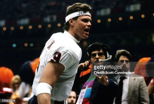 Quarterback Jim McMahon of the Chicago Bears celebrates after winning Super Bowl XX against the New England Patriots at the Louisiana Superdome on...