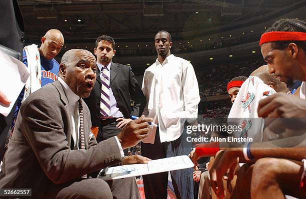 Assistant coach Garfield Heard of the Detroit Pistons instructs his team during a timeout against the Dallas Mavericks during the game at The Palace...