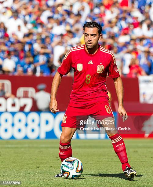 Spain National Team player Xavi Hernandez is part of the team that will be representing Spain in the upcoming 2014 FIFA World Cup drives forward...