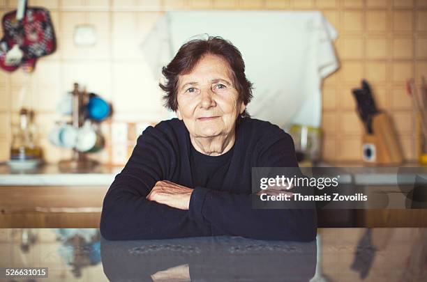 portrait of a senior woman - portrait home stock-fotos und bilder