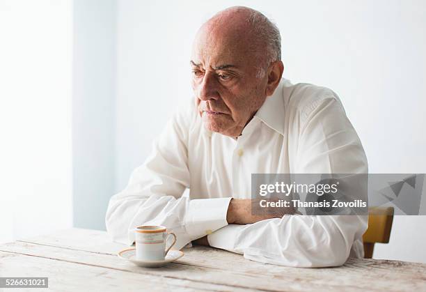 portrait of a senior man - senior men coffee stock pictures, royalty-free photos & images