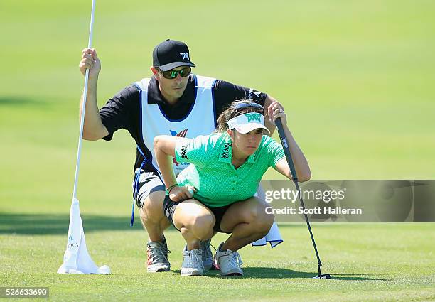 Gerina Piller looks over the tenth green with her caddie Brian Dilley during the third round of the Volunteers of America Texas Shootout at Las...