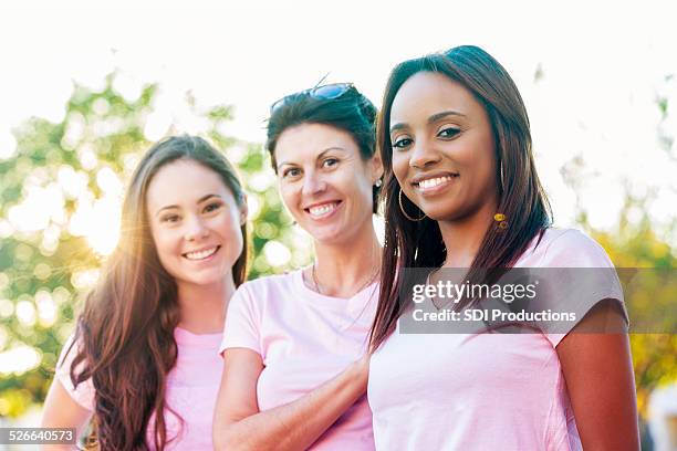 diverse group of breast cancer survivors and awareness supporters - cancer support stock pictures, royalty-free photos & images