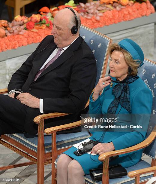 King Harald V and Queen Sonja attend the Nobel Peace Prize award ceremony at Oslo City Hall.