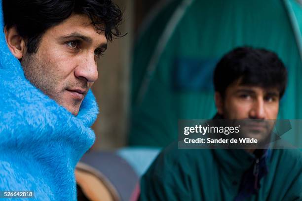 November 2011. Refugees stand in line at Fedasil, the official governmental organisation where all refugees have to get their files be judged. These...