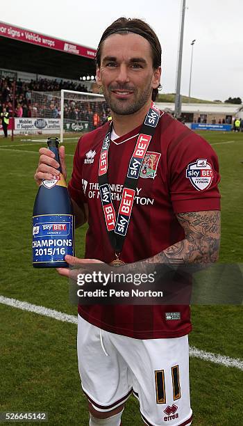 Ricky Holmes of Northampton Town celebrates with champagne after the Sky Bet League Two match between Northampton Town and Luton Town at Sixfields...