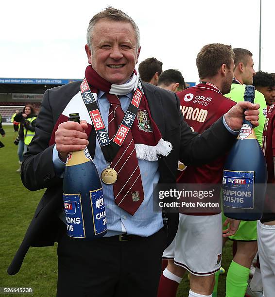 Northampton Town manager Chris Wilder celebrates with champagne after Sky Bet League Two match between Northampton Town and Luton Town at Sixfields...