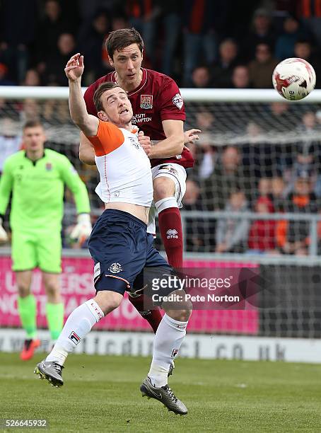 Luke Prosser of Northampton Town contests the ball with Luke Prosser of Luton Town during the Sky Bet League Two match between Northampton Town and...