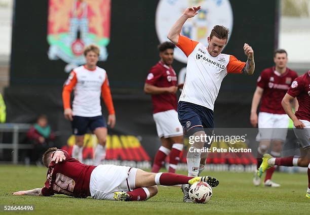 Jack Marriott of Luton Town evades the challenge of James Collins of Northampton Town during the Sky Bet League Two match between Northampton Town...