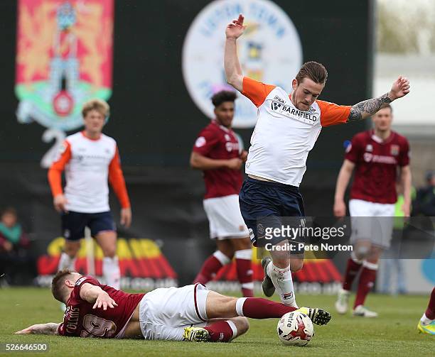 Jack Marriott of Luton Town evades the challenge of James Collins of Northampton Town during the Sky Bet League Two match between Northampton Town...
